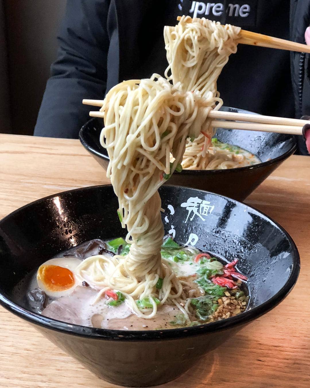 two ramen with noodles picked up