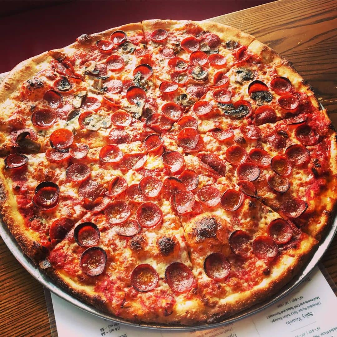 pepperoni pizza on wooden table