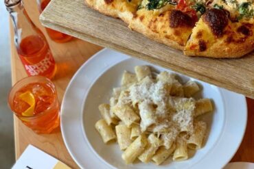 best italian restaurants in vancouver - di beppe pizza and pasta and spritz on table