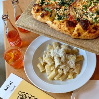 best italian restaurants in vancouver - di beppe pizza and pasta and spritz on table