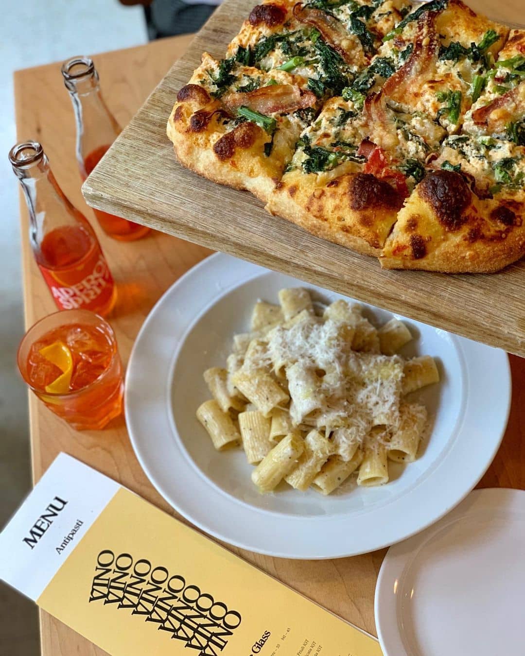 best italian restaurants in vancouver - di beppe pizza and pasta and spritz on table