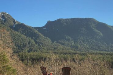 Things to Do in Vancouver When You’re Low on Budget -lower seymour conservation two red chairs among mountain view
