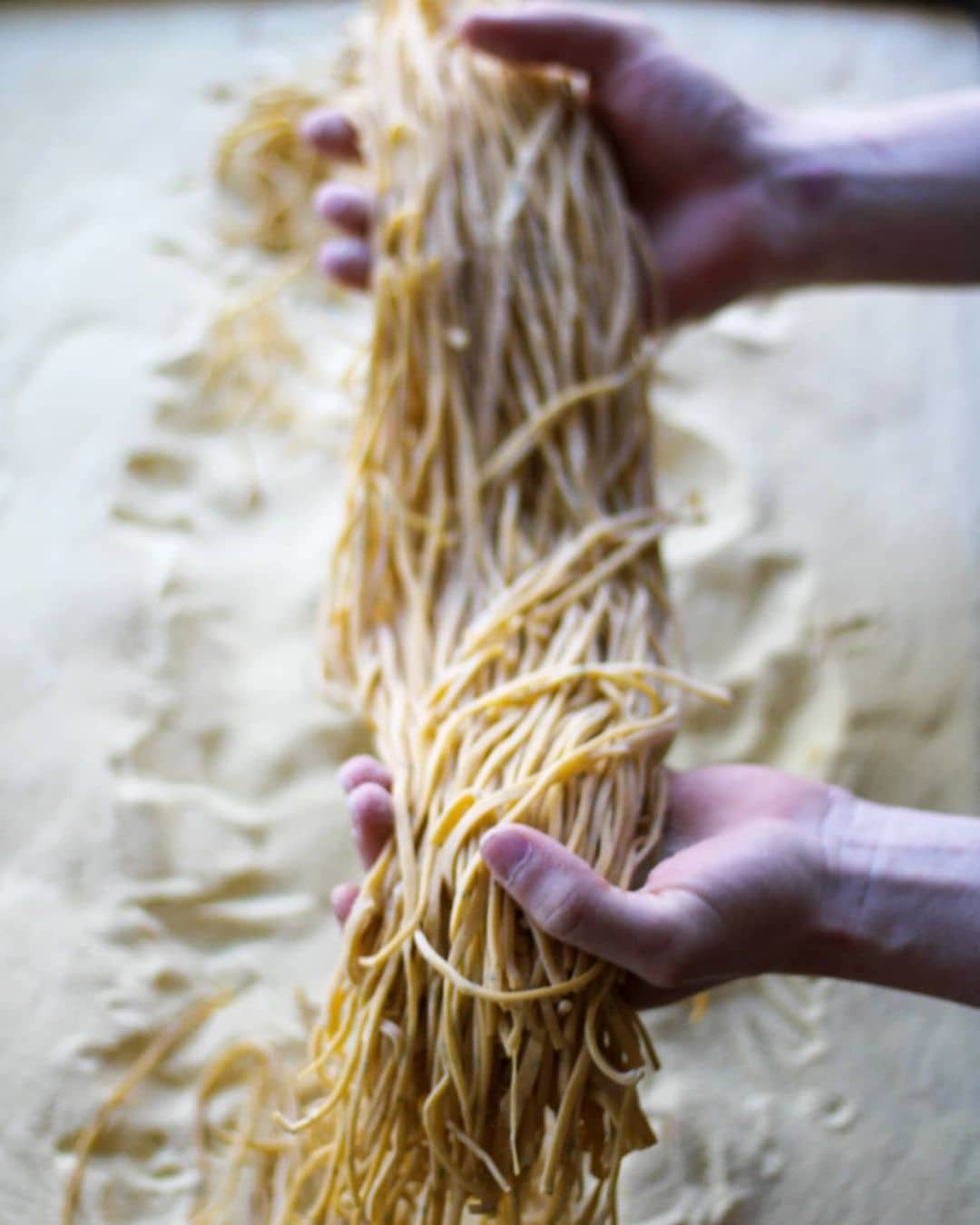 Places to Eat and Drink in Tofino - sobo fresh soba noodles being held ontop of flour