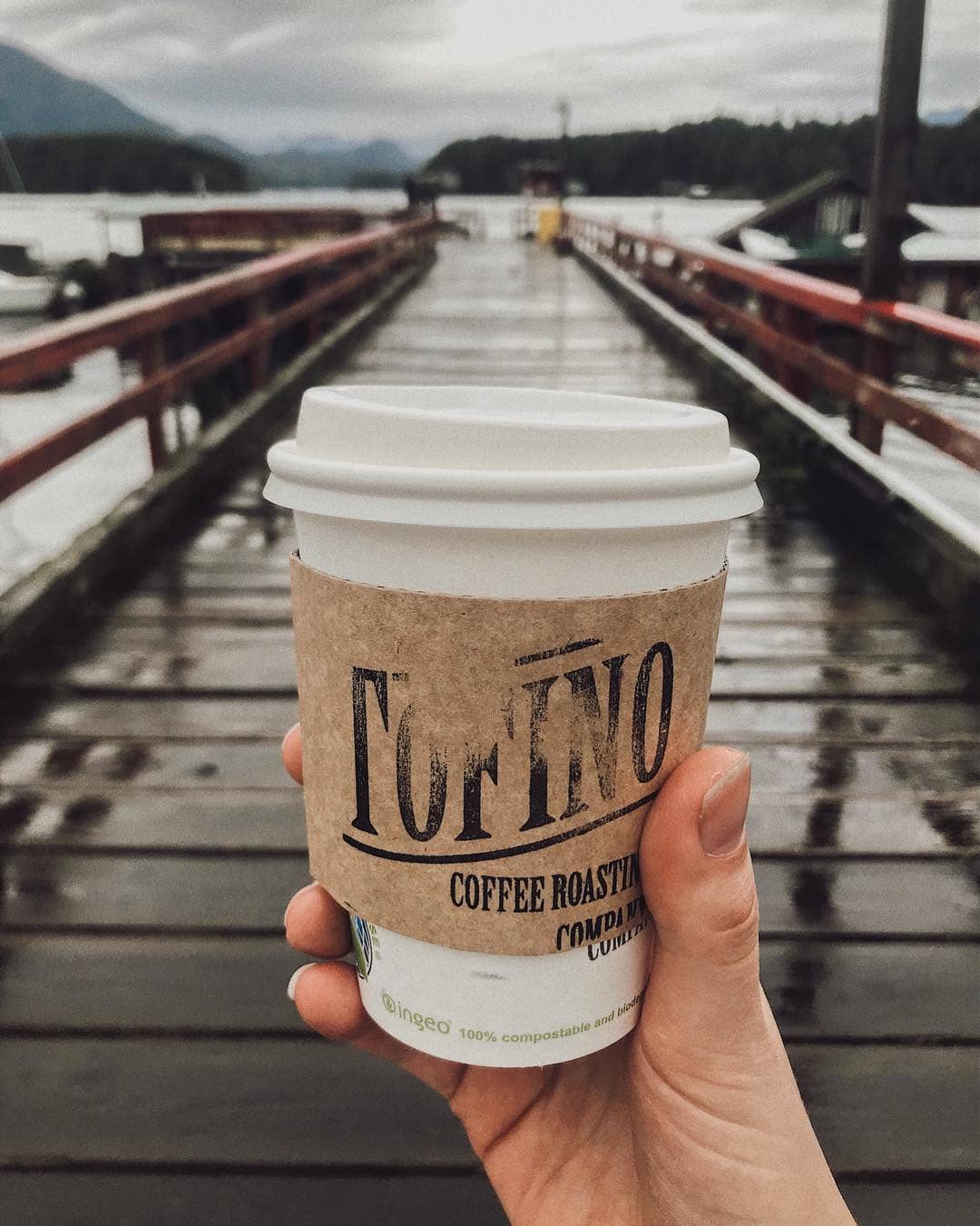Places to Eat and Drink in Tofino - tofino coffee co coffee cup with logo sleeve