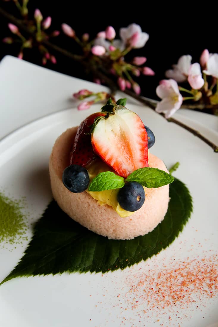 Yuwa japanese cuisine - sakura themed roll cake with fruits on plate