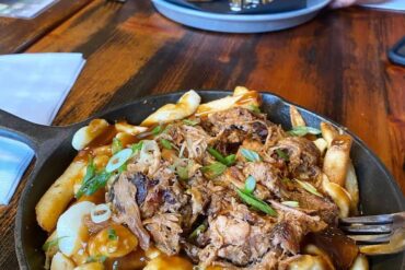 best squamish restaurants - copper coil still poutine in skillet on table