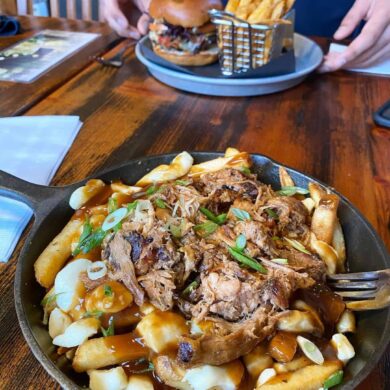 best squamish restaurants - copper coil still poutine in skillet on table