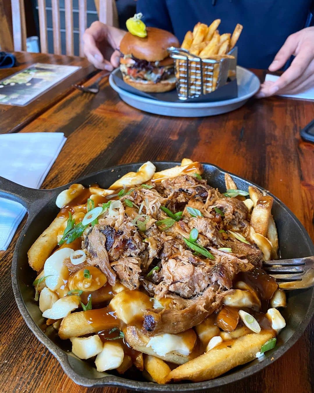 best squamish restaurants - copper coil still poutine in skillet on table