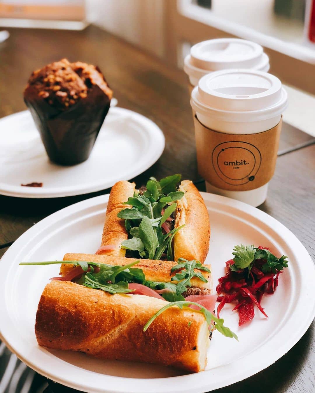 best burnaby breakfast - ambit cafe Chicken cosmos sub on plate and coffee cup on table