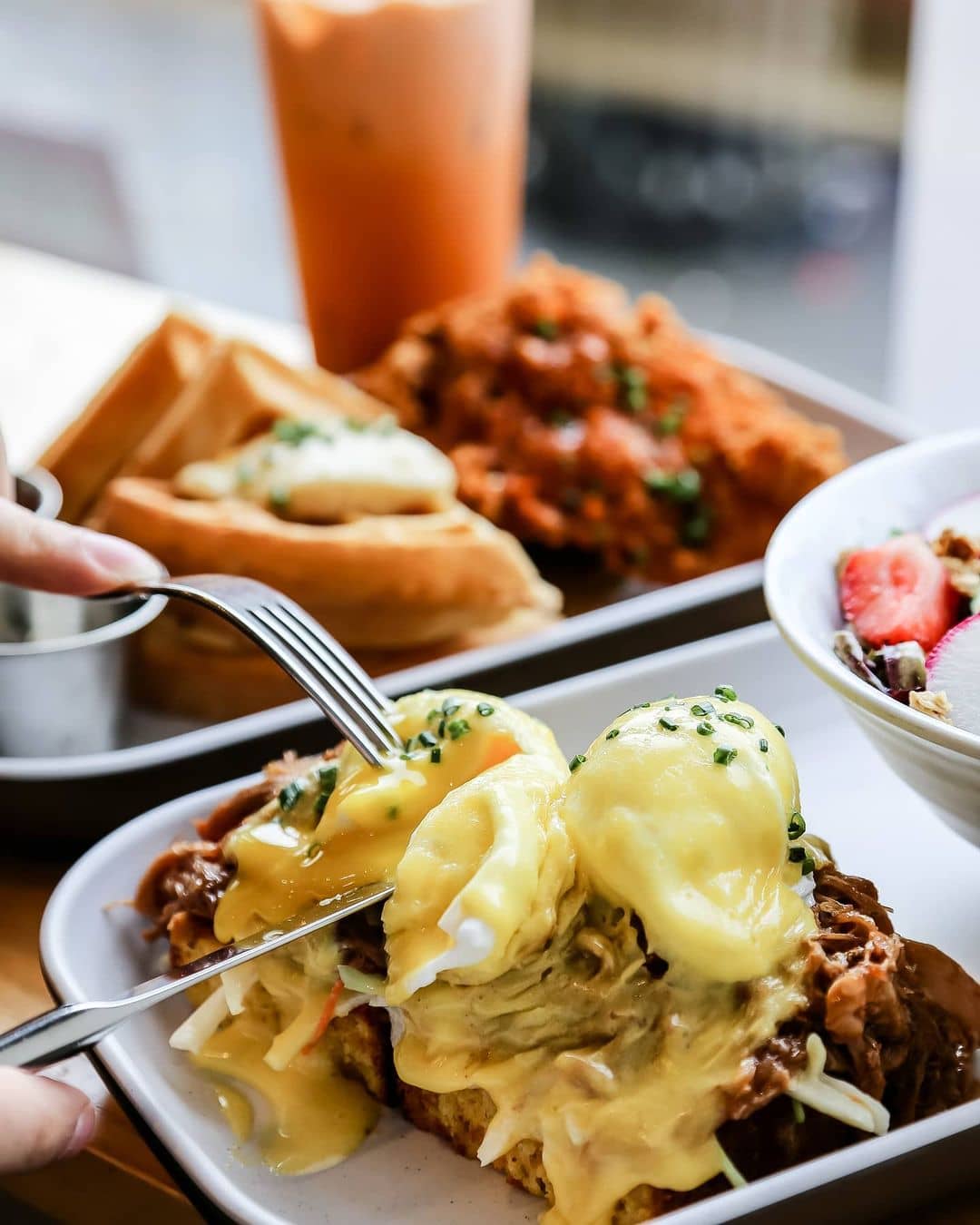 best burnaby breakfast - the gray olive egg bennies on plate and chicken waffle in background