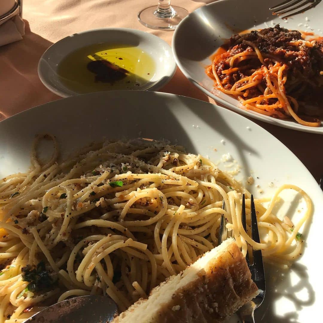 two pastas in plates on table with olive oil best west vancouver restaurants - casa di amici
