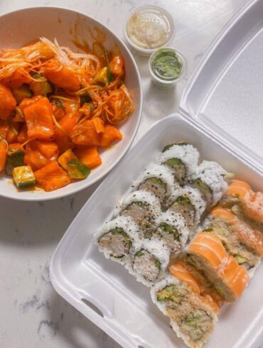 roll of sushi in take out box and spicy salmon sashimi in bowl on the side - best coquitlam sushi - sushi california